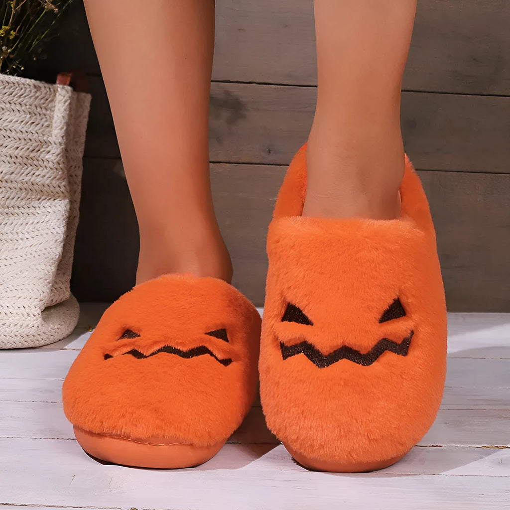 Orange pumpkin design Halloween slippers with plush lining and PVC sole for indoor home wear
