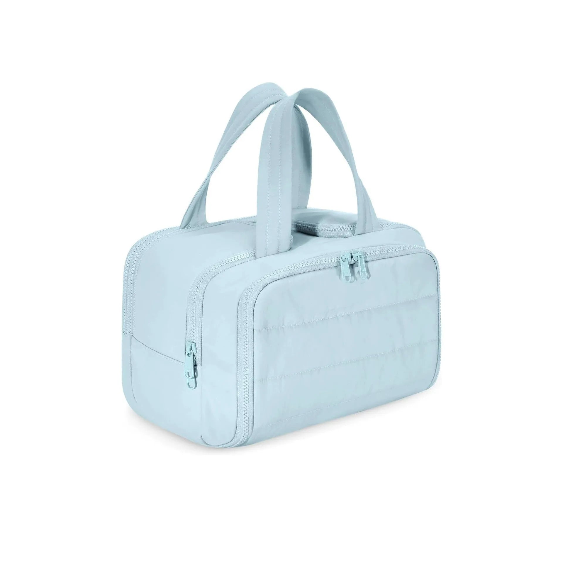 Large fluffy travel toiletry bag in beige colour with wide open design showing interior