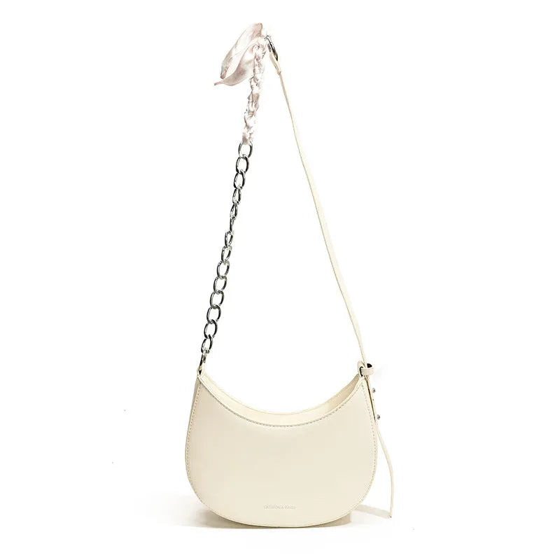 Small PU leather saddle bag on a flat surface, available in black, brown, coffee, green, khaki, and white