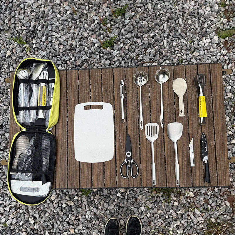 12-piece stainless steel picnic utensil set inside a khaki portable storage bag for outdoor dining.
