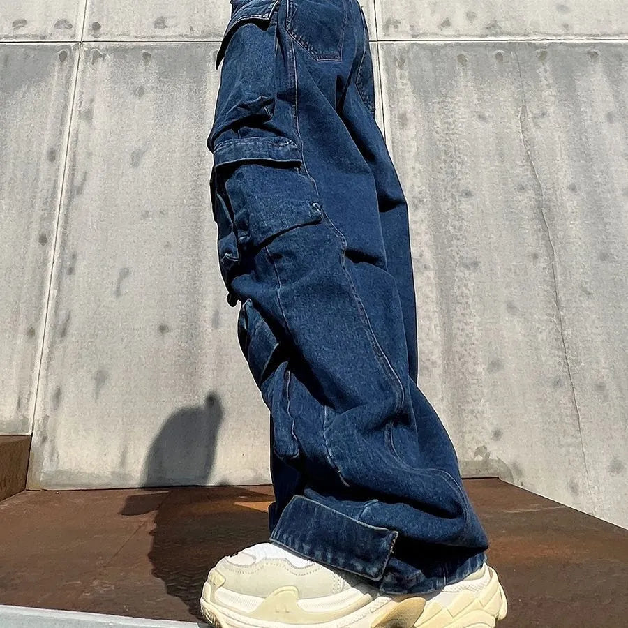 Dark blue distressed wide-leg jeans with high waist and multiple pockets on mannequin