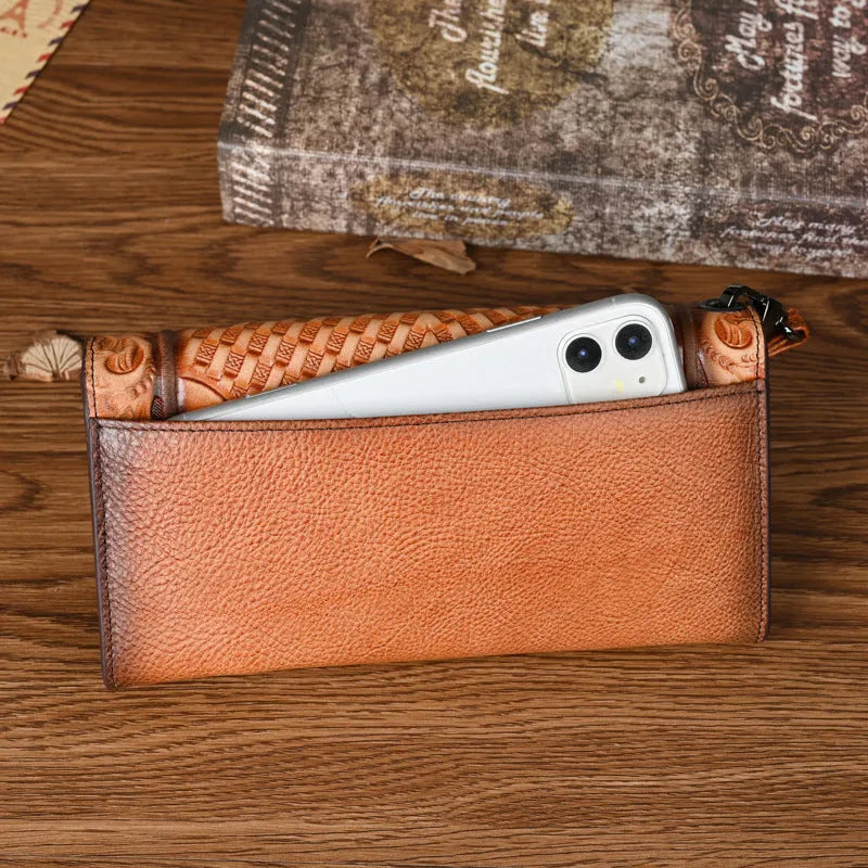 Women's brown tri-fold cowhide wallet with embossed floral pattern, shown open and closed.