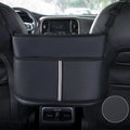 Black leather car seat storage bag with a carbon fibre pattern, shown mounted between car seats.