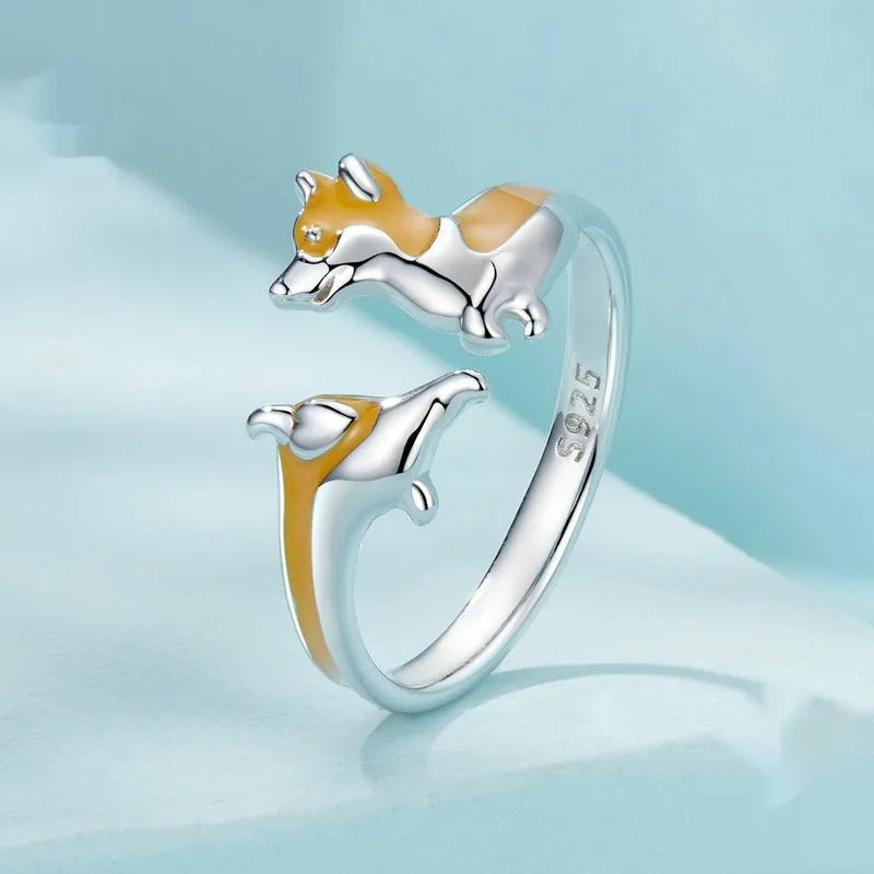 Adjustable silver-plated ring featuring a cartoon sitting corgi dog design.