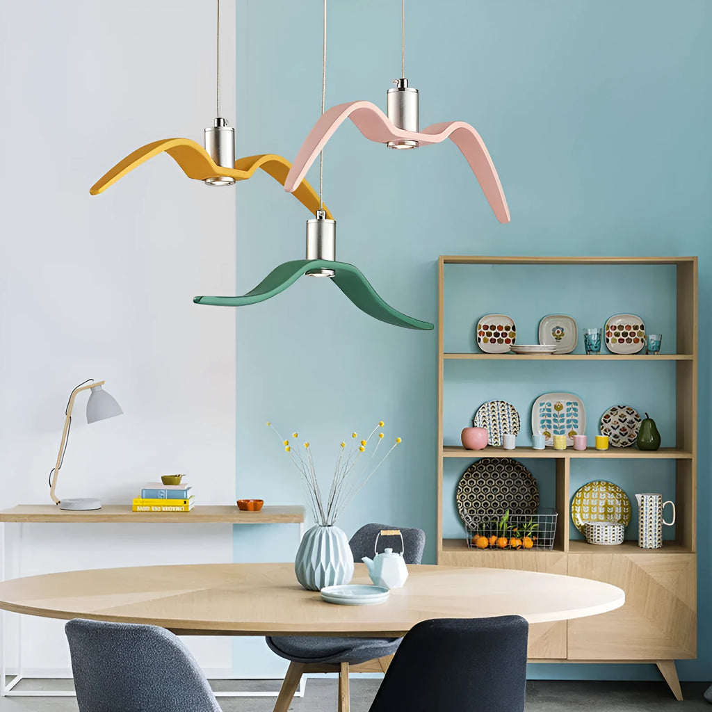 Nordic style ceiling chandelier with macaron colour options shown in a dining room setting.