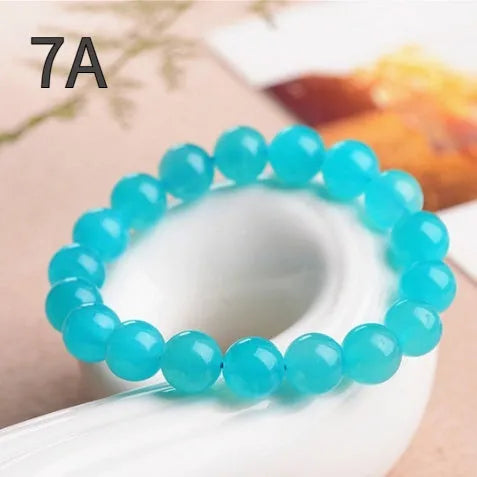 Natural 7A grade ice blue amazonite beads on a string, showing polished surfaces and varying sizes.