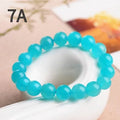 Natural 7A grade ice blue amazonite beads on a string, showing polished surfaces and varying sizes.