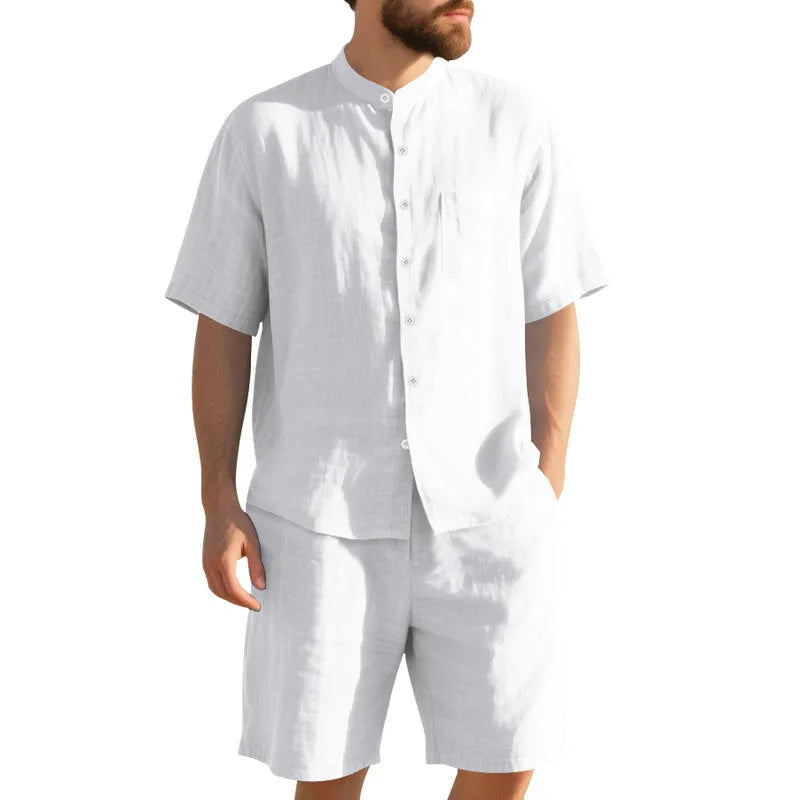 Men's light blue linen blend summer suit with henry collar, short sleeves, and matching shorts