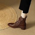 Women's black ankle boots with pointed toe and 5.5cm heel, artificial PU construction