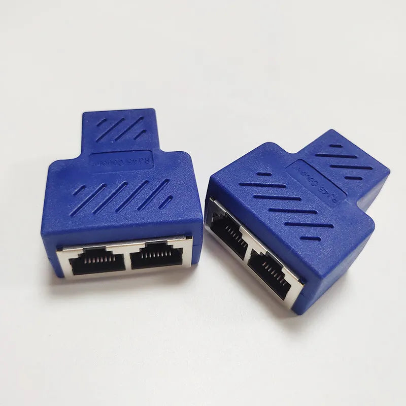 White RJ45 network cable tee splitter adapter on a dark background