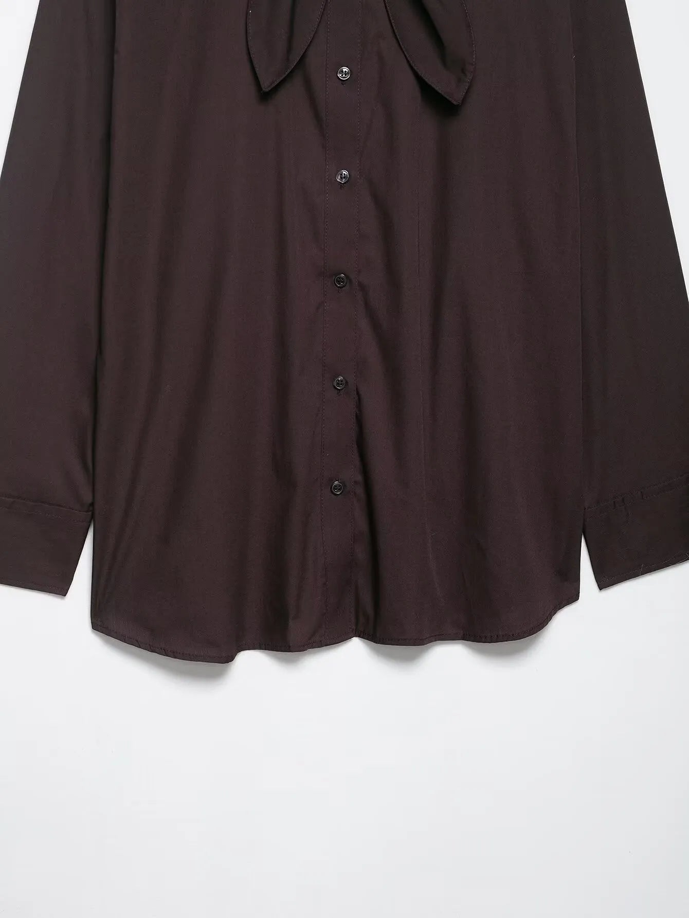 Brown women's loose fit poplin shirt with long sleeves and a scarf bow tie detail.