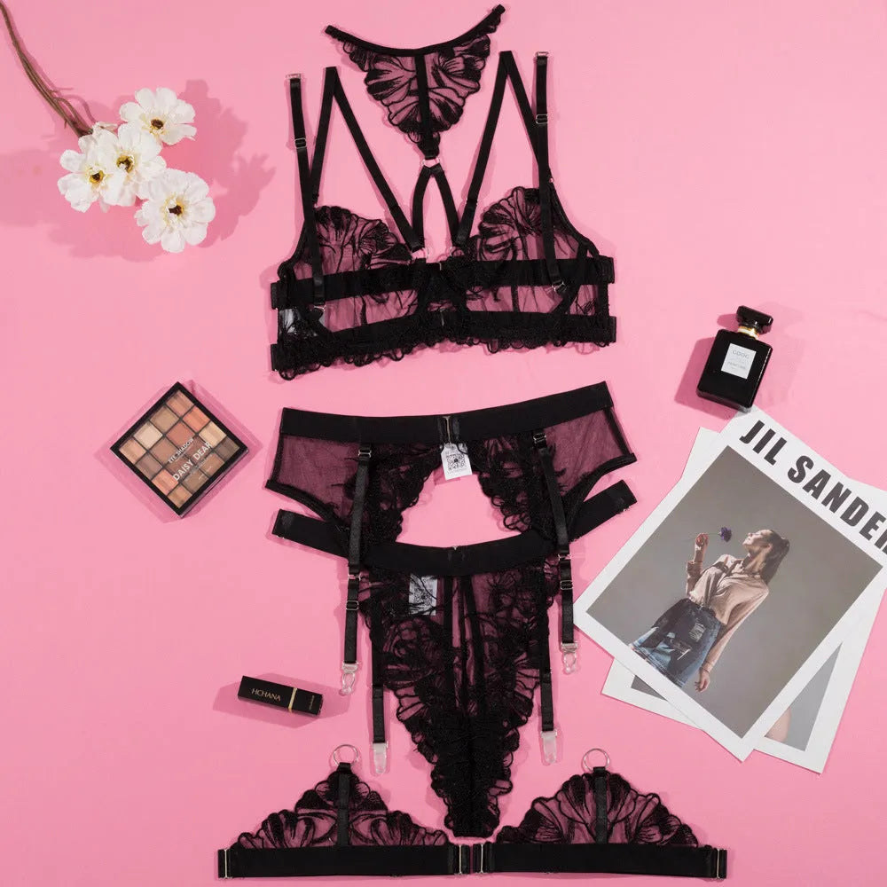 Black women's bikini set with embroidery stitching detail on the mesh fabric, three-point style.