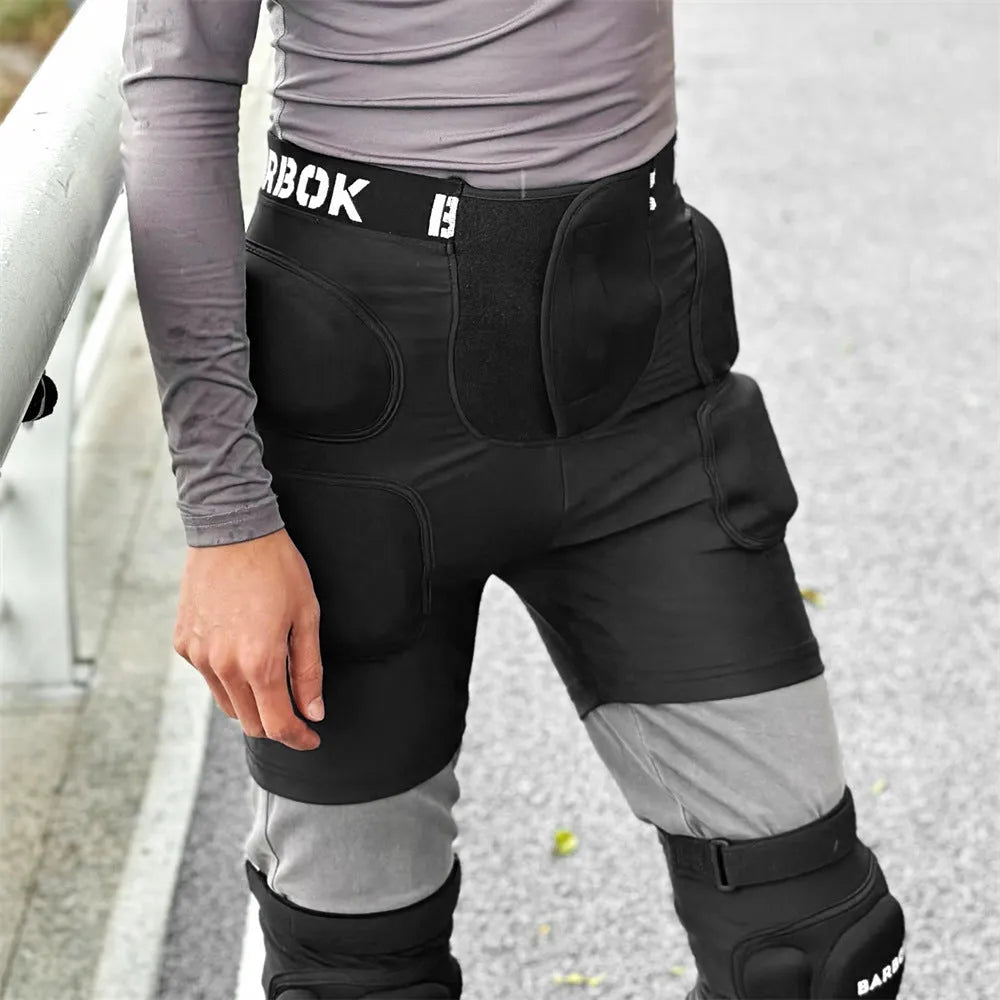 Black spandex hip protection pad with removable NBR foam inserts for skating and skiing safety.
