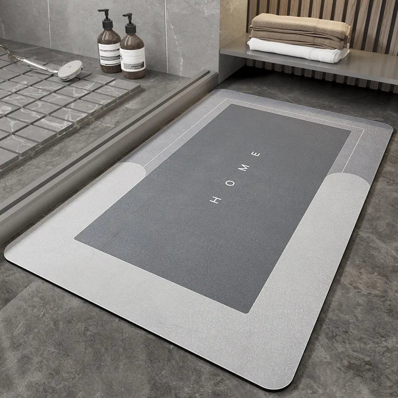 Blended fabric bathroom floor mat in blue colour, shown in an oval shape on a tiled floor.