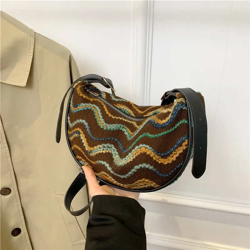 Women's straw woven crossbody bag with internal phone and document pockets in corrugated finish