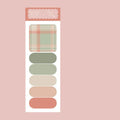 Colourful memo pad with plaid design sticky notes showing six different patterns