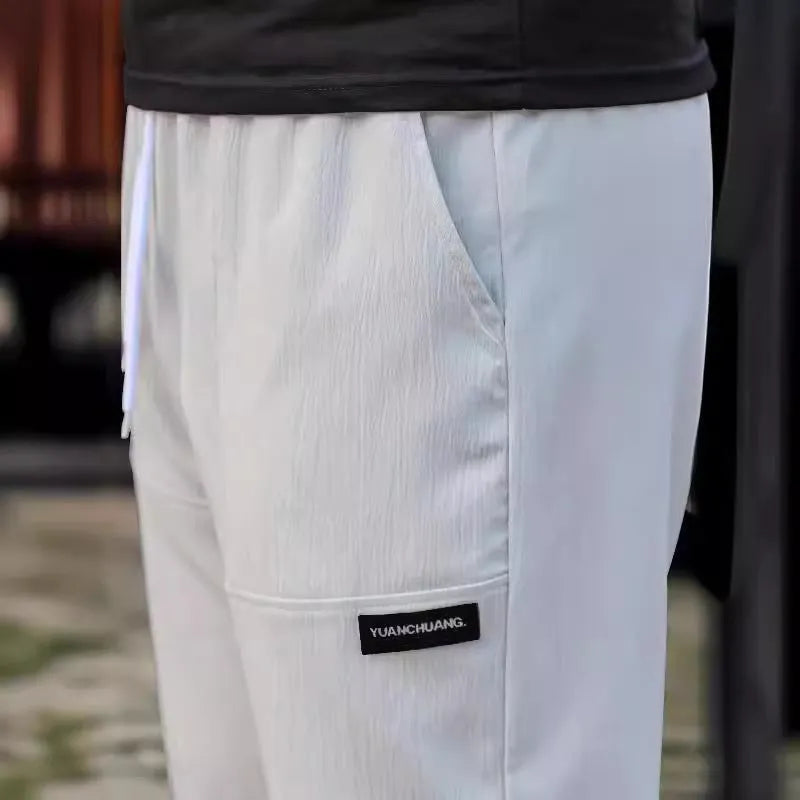 Men's polyester trousers in multiple colours including light grey, dark green, black for spring and autumn wear