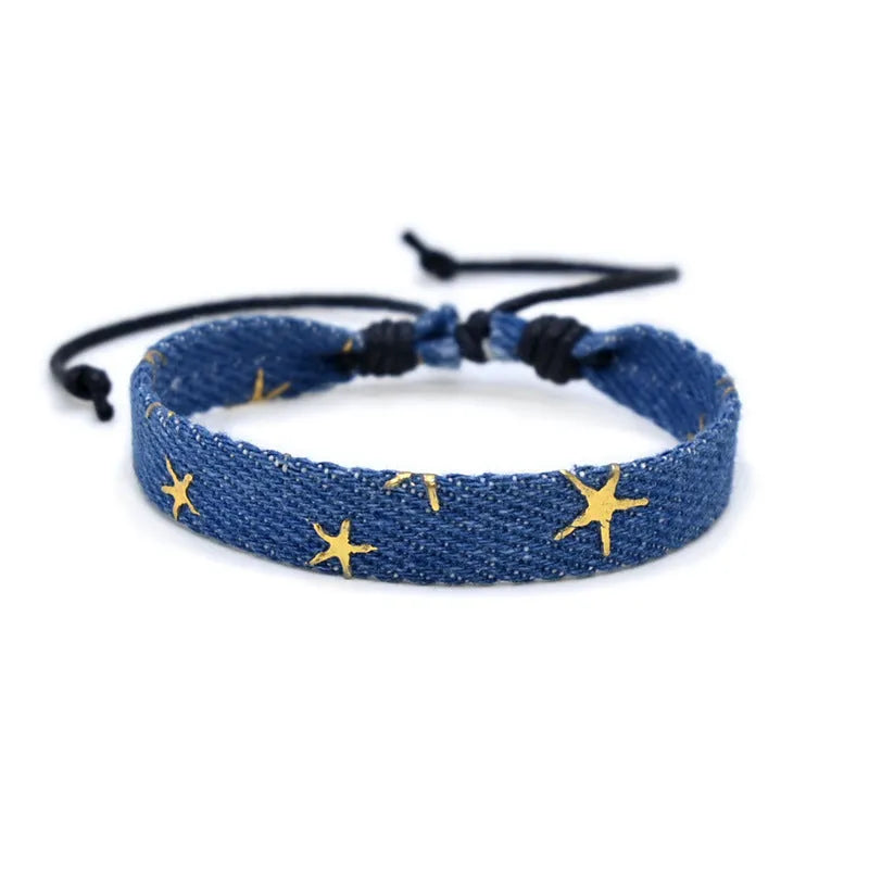 Handmade denim fabric wristband carrying strap in mixed materials with adjustable closure