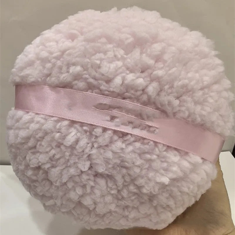 Oversized rectangular plush powder puff measuring 150x75mm in white colour
