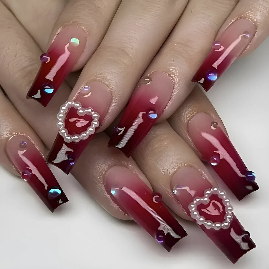 Wine red gradient false nail tips with heart and pearl pattern in long ballet style