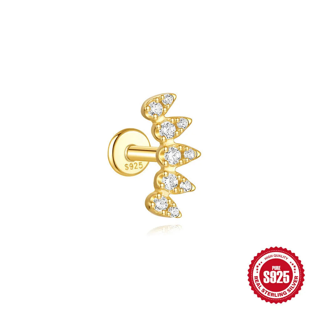 Geometric kite-shaped sterling silver earring with rhinestone head and gold chain tassel.