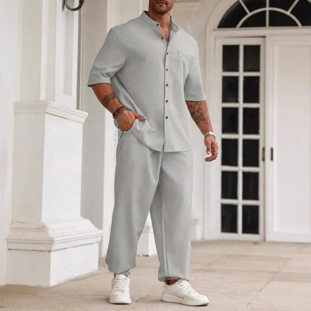 Men's casual apricot coloured cotton linen short sleeve shirt and trousers set laid flat.