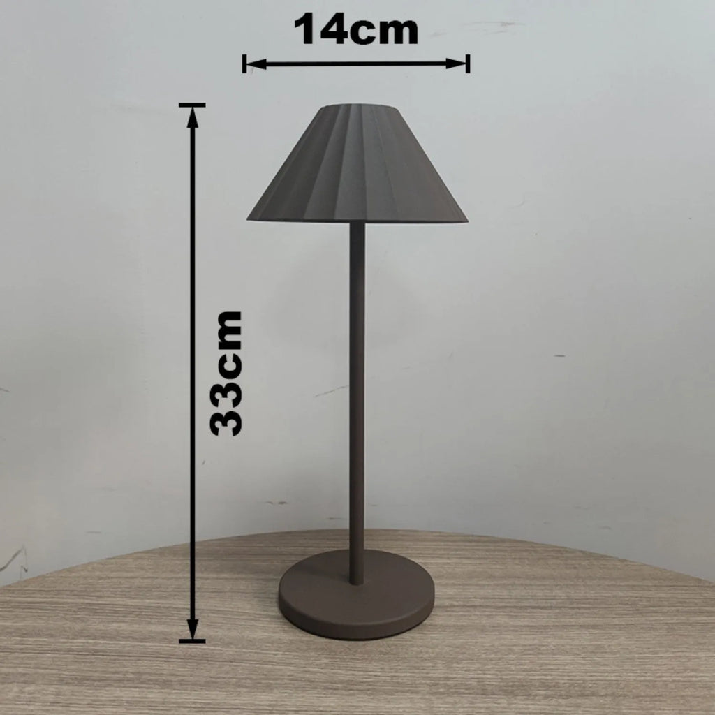 Black alloy desk lamp with touch dimming control and USB-C charging port on base.