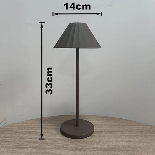 Black alloy desk lamp with touch dimming control and USB-C charging port on base.
