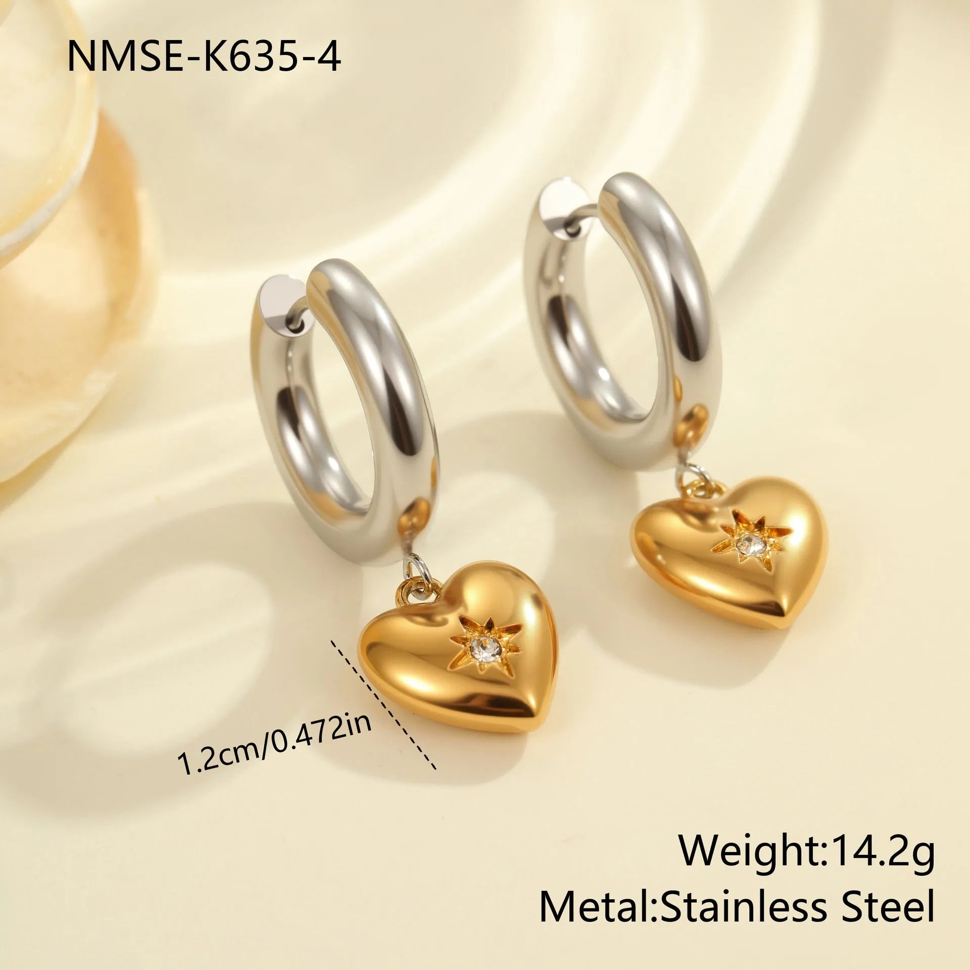 A pair of stainless steel earrings with an 18K gold colour finish, shown in a Christmas tree shape and a heart shape.