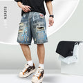 Blue ripped men's denim shorts with graffiti pattern and straight-leg cut.