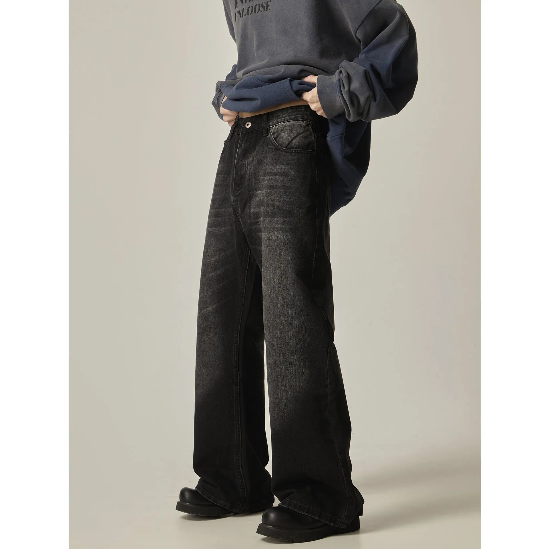 Black loose straight cut retro jeans with zipper fly on mannequin showing full silhouette