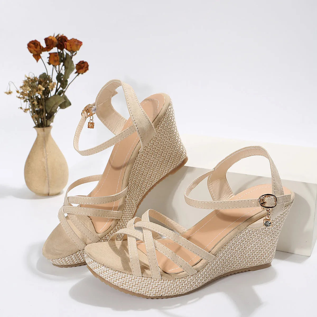 Women's wedge sandal with fish mouth toe design in black cloth upper.