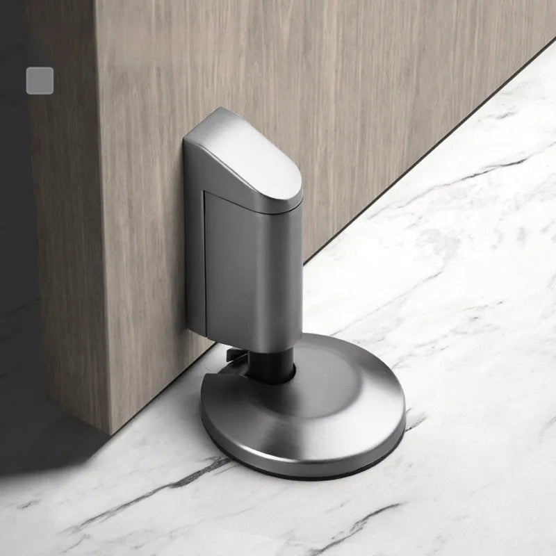 Zinc alloy invisible wedge door stopper with magnetic catch in six colour finishes.