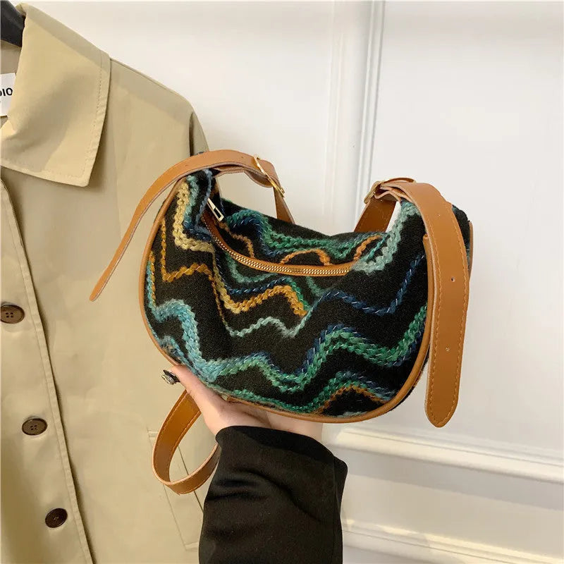Women's straw woven crossbody bag with internal phone and document pockets in corrugated finish