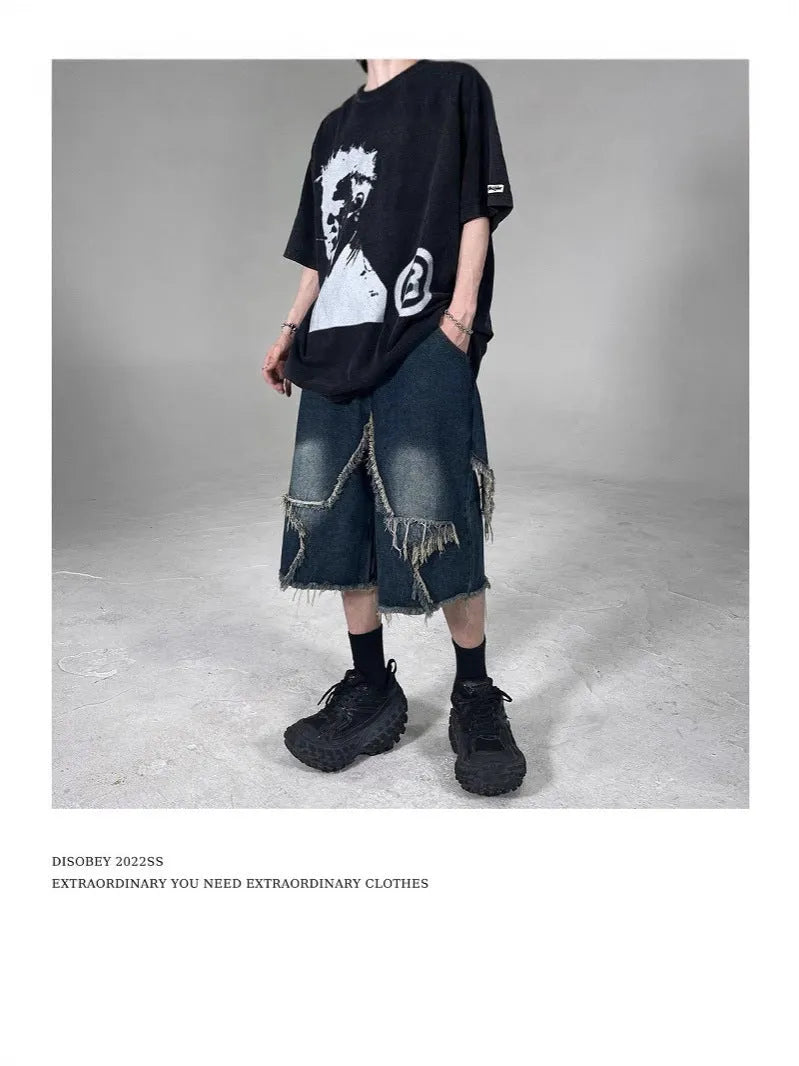 Blue denim shorts with frayed detailing and five-pointed star design in loose fit