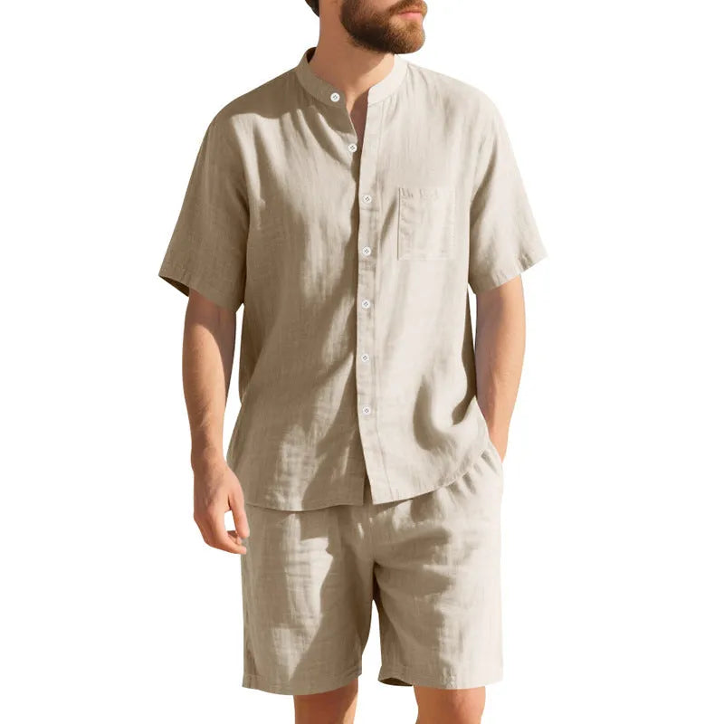 Men's light blue linen blend summer suit with henry collar, short sleeves, and matching shorts