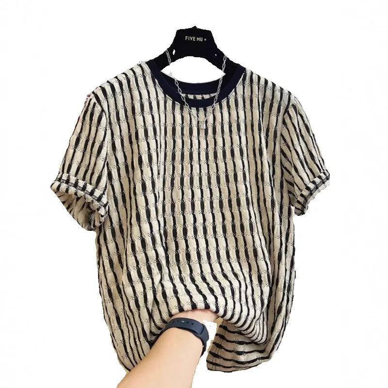 A man's loose-fitting black and white striped casual pullover shirt made from linen and silk.