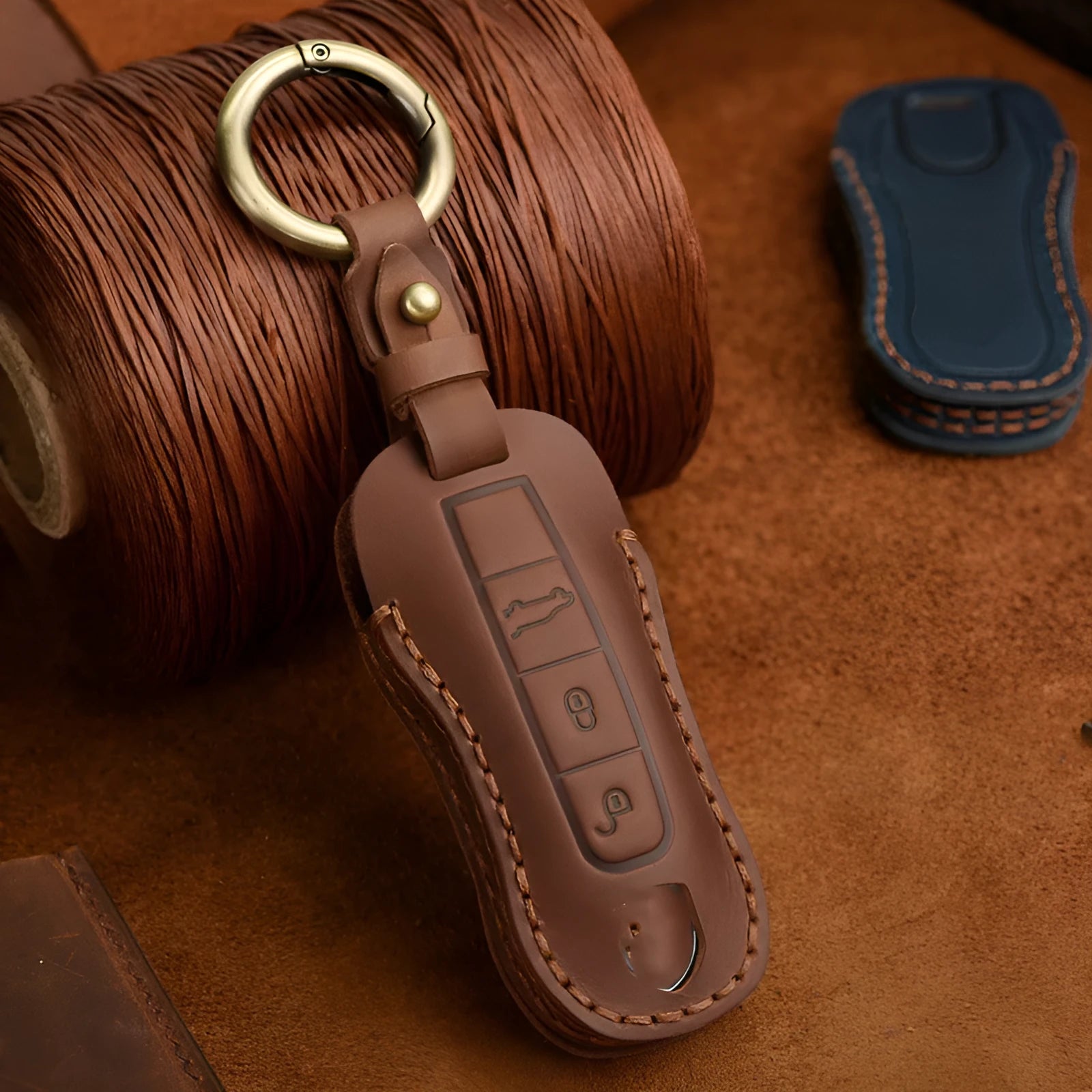 Porsche leather key cover with retro buckle in blue and brown cowhide options