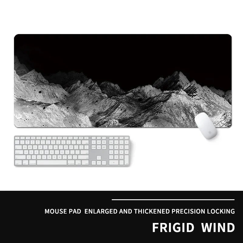 Oversized thick gaming mouse pad with printed e-sports design on a desk with keyboard and mouse.