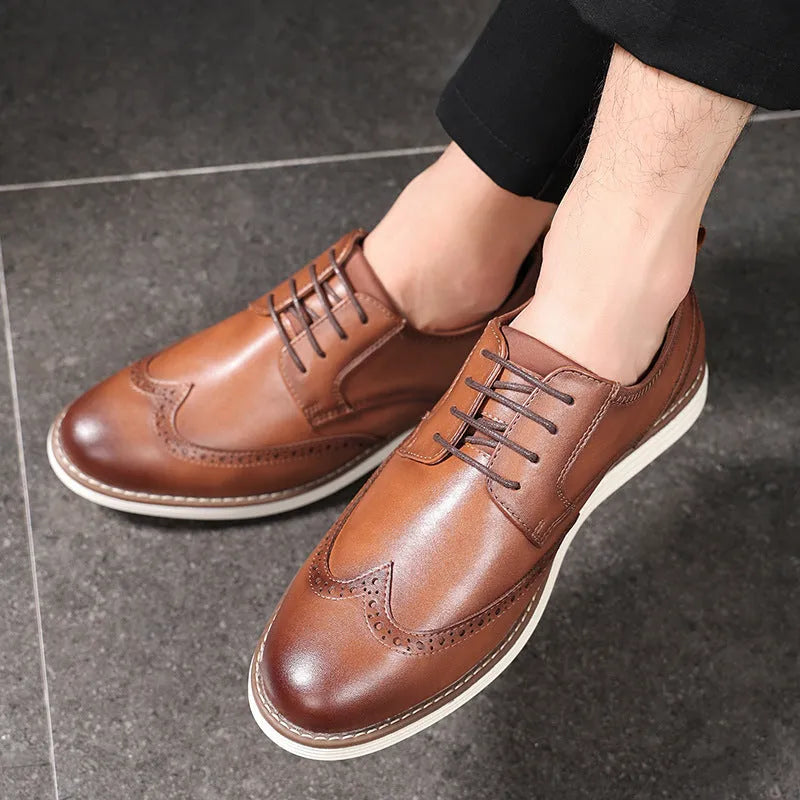 Men's black slip-on business casual shoes with round toe and decorative carving details