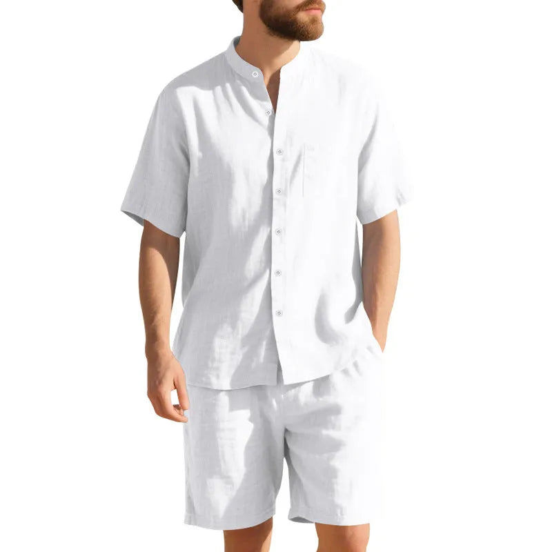 Men's light blue linen blend summer suit with henry collar, short sleeves, and matching shorts