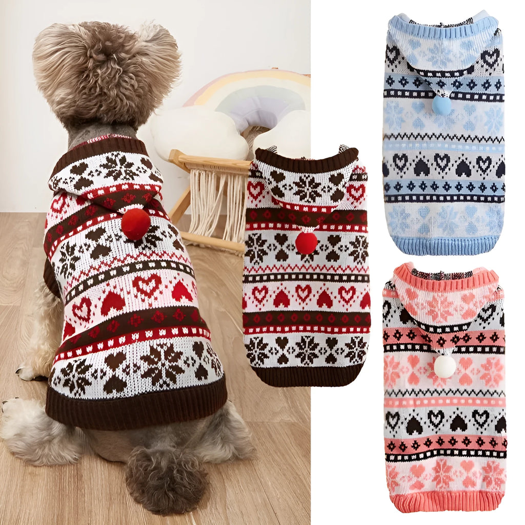 Pink knitted dog jumper with snowflake, love heart, and striped camouflage pattern on a small white dog.
