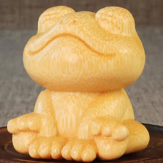 Smiling frog bamboo carving ornament measuring 5cm height with cartoon cute style decorative design