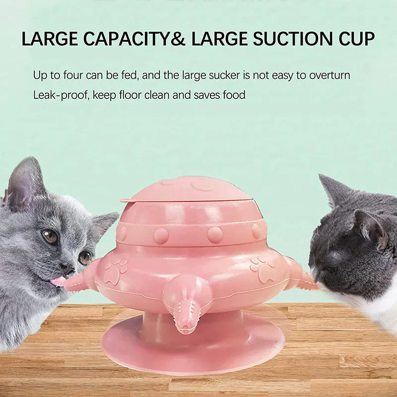 Pink silicone pet milk feeder with four nursing pacifiers and a lid on a flat base.