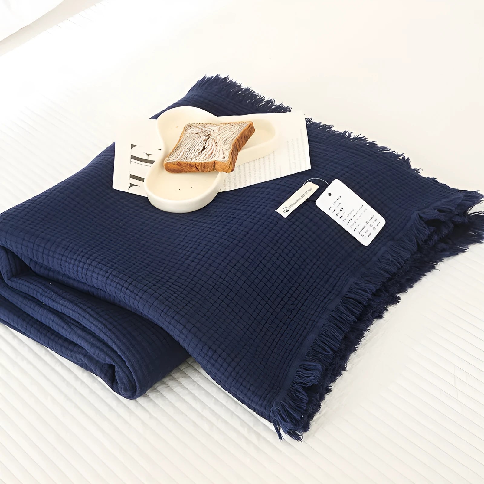 Four-layer gauze cotton blanket with tassel detailing in navy blue colour option