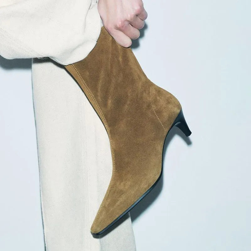 Brown square toe ankle boot with side zip and a mid-height stiletto heel on a waterproof platform sole.