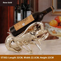 Lobster-shaped wine rack ornament in rose gold or silver metallic finish