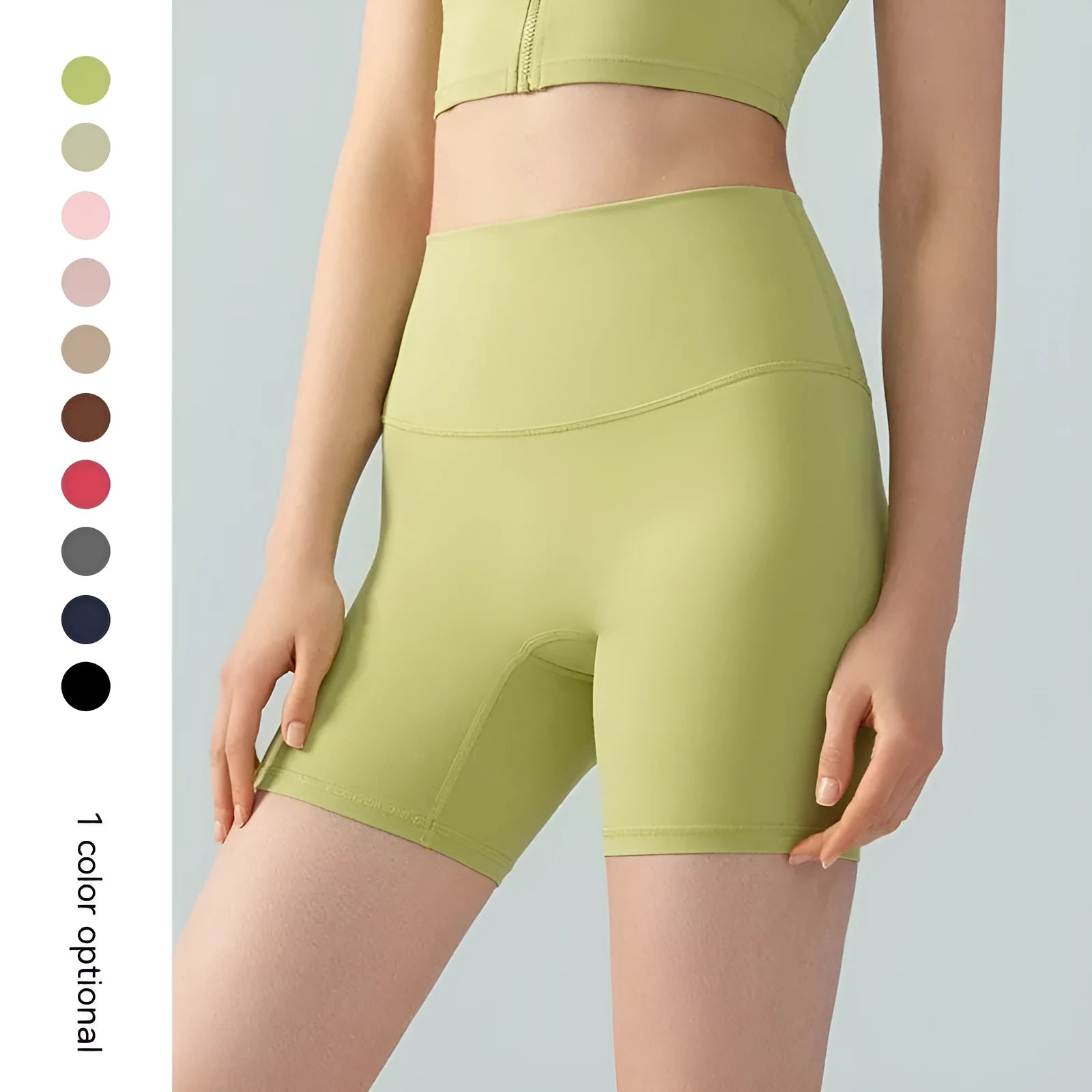 Women's high-waisted Lycra yoga shorts in leaf green, showing anti-exposure construction and short length.