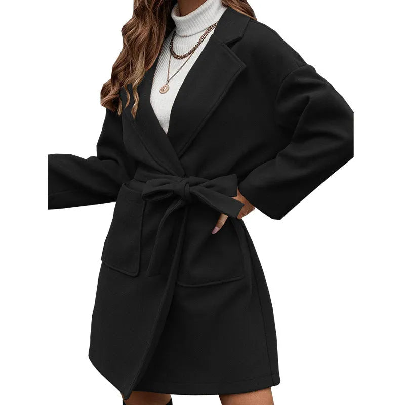 Long sleeve brown lapel button coat with a split belt, shown in a loose fit.