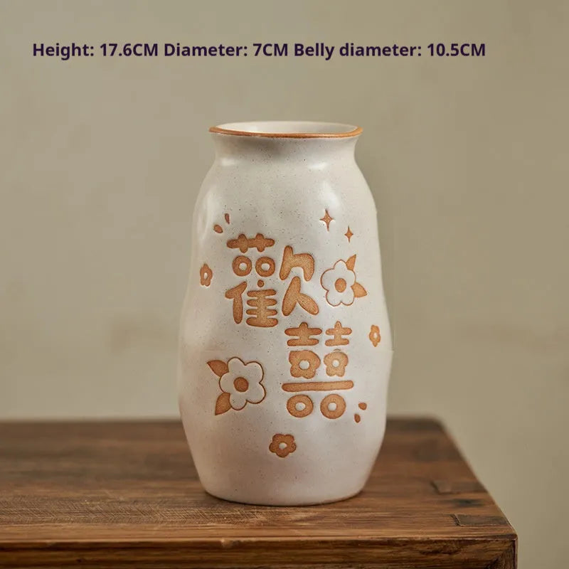 Chinese hand-painted ceramic vase with persimmon fruit designs on wooden desktop